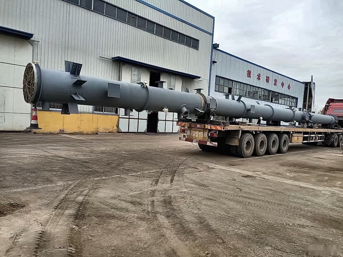 Large fabricated vessel ready for shipping on flatbed trailer